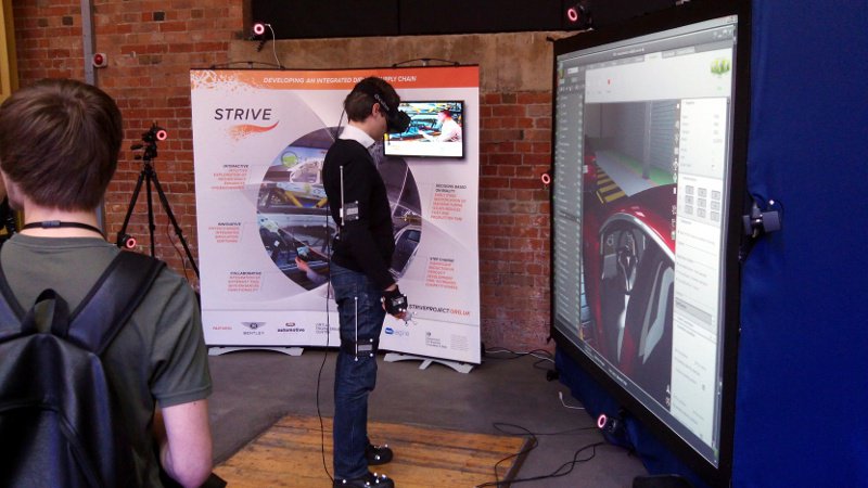 A visitor checks the virtual cockpit of a Tesla Model S